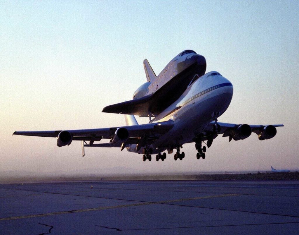 shuttle endeavour mated to 747 sca takeoff for delivery to kennedy space center florida
